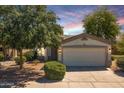 Attractive single-story home featuring desert landscaping, a two-car garage and desert sky at 30259 N Sunray Dr, San Tan Valley, AZ 85143