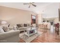 Inviting living room showcasing wood floors, a ceiling fan, and an open-concept layout at 30259 N Sunray Dr, San Tan Valley, AZ 85143