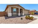 Charming single story home with a desert landscape and neutral color palette at 42519 W Centennial Ct, Maricopa, AZ 85138
