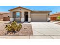 Charming single story home with a desert landscape and neutral color palette at 42519 W Centennial Ct, Maricopa, AZ 85138