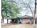 Charming single-story brick home features mature trees, a well-manicured lawn, and inviting curb appeal at 4515 N 35Th St, Phoenix, AZ 85018