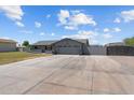 Inviting single-story home with a huge driveway and a two-car garage providing ample parking space at 4602 W Monte Cristo Ave, Glendale, AZ 85306