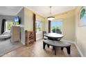 Charming dining area with modern lighting, a round table, bench seating, and a view of the outdoors at 5335 E Shea Blvd # 1087, Scottsdale, AZ 85254