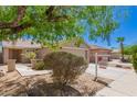 Quaint single-story home with desert landscaping, charming facade, and 