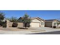 Charming single-story home with a two-car garage, desert landscaping, and a welcoming entrance at 5616 W Hidalgo Ave, Laveen, AZ 85339