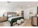 Bright main bedroom with a king-size bed, ensuite bathroom, and walk-in closet at 7223 N 14Th St, Phoenix, AZ 85020