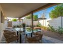 Covered outdoor patio with dining table and chairs, perfect for al fresco dining at 7223 N 14Th St, Phoenix, AZ 85020