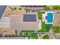 Aerial view showcasing the property's private backyard pool, turf, and solar panels at 7260 E Tasman St, Mesa, AZ 85207