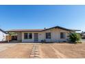 Charming single-story home with desert landscaping and covered carport at 8339 W Devonshire Ave, Phoenix, AZ 85037