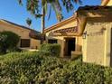 Inviting home exterior with lush landscaping, creating a private setting at 11028 W Crimson Ln, Avondale, AZ 85392