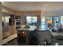 Modern kitchen featuring a wine cooler, granite countertops, and ample storage at 11028 W Crimson Ln, Avondale, AZ 85392