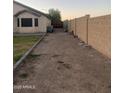 A spacious, enclosed backyard with desert landscaping at 12501 W Rosewood Dr, El Mirage, AZ 85335