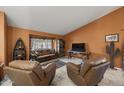 Bright living room with tile floors, comfortable seating, and plenty of natural light at 13593 N 91St Way, Scottsdale, AZ 85260
