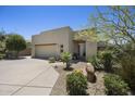 Single Gathering home with desert landscaping and private driveway at 14007 E Lupine Ave, Scottsdale, AZ 85259