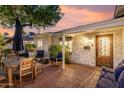 Relaxing backyard patio with an outdoor dining table, seating area, and cozy lighting for evening gatherings at 1625 N 11Th Ave, Phoenix, AZ 85007