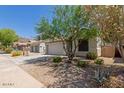 Well-maintained single-Gathering home with desert landscaping and a two-car garage at 16813 S 30Th Ave, Phoenix, AZ 85045