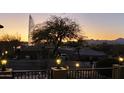 Tranquil backyard view featuring a fountain and desert landscaping at sunset at 17214 E Alta Loma --, Fountain Hills, AZ 85268