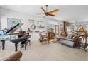 Stylish living room featuring a piano, comfortable seating, and unique decor at 17214 E Alta Loma --, Fountain Hills, AZ 85268