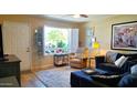 Bright living room featuring a large window, comfortable seating, and stylish decor at 2064 S Farnsworth Dr # 38, Mesa, AZ 85209