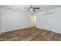 Spacious bedroom with new floors, a ceiling fan, and a large closet at 222 W Brown Rd # 72, Mesa, AZ 85201
