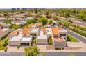 Aerial view of the condo's terracotta roofs, desert landscaping, and attached garages at 2413 E Rancho Dr, Phoenix, AZ 85016