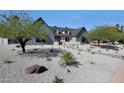 Charming home with modern farmhouse style and desert landscaping at 6126 E Charter Oak Rd, Scottsdale, AZ 85254