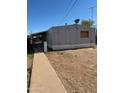 Image showcasing the exterior of a house featuring desert landscaping at 614 W 12Th St, Casa Grande, AZ 85122