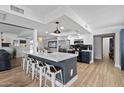 Modern kitchen with a large island, stainless steel appliances, and stylish two-tone cabinetry at 7020 E Friess Dr, Scottsdale, AZ 85254