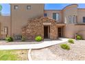 Inviting entryway featuring stone accents and desert landscaping at 7445 E Eagle Crest Dr # 1111, Mesa, AZ 85207