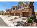 Beautiful exteriors highlight the home's inviting entrance and well-maintained landscaping at 7445 E Eagle Crest Dr # 1111, Mesa, AZ 85207