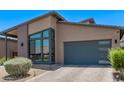 A modern single-Gathering home boasting a two-car garage and unique desert landscaping at 939 E Paseo Way, Phoenix, AZ 85042