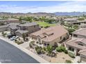 Expansive aerial view showcasing a single-Gathering home with mature landscaping and neighborhood amenities at 9722 S 45Th Ave, Laveen, AZ 85339