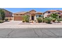 Charming single-story home with desert landscaping and a two-car garage at 9722 S 45Th Ave, Laveen, AZ 85339