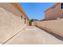 Long side yard area offering extra space for storage or potential landscaping at 9722 S 45Th Ave, Laveen, AZ 85339