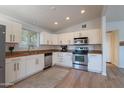 Well-equipped kitchen features stainless steel appliances, ample counter space, and white cabinets at 1219 E Colter St # 8, Phoenix, AZ 85014