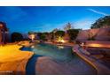 Backyard oasis with a sparkling pool, spa, and rock features, perfect for relaxation and entertaining at 17975 W Willow Dr, Goodyear, AZ 85338