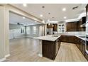 Open kitchen flowing into the living area, featuring granite countertops and stainless-steel appliances at 18562 N 94Th St, Scottsdale, AZ 85255