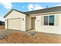 Delightful single-Gathering home with an attached garage, featuring a welcoming entrance and manicured surroundings at 18931 W Crescent Way, Buckeye, AZ 85326