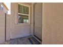 Inviting front door with a welcome mat, window, and neutral-toned exterior at 21047 N 58Th Way, Phoenix, AZ 85054