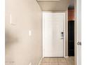 Clean, simple condo entry featuring tile floors and a secure-entry door at 2134 E Broadway Rd # 2030, Tempe, AZ 85282