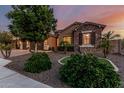 Landscaped front yard with stone accents and mature landscaping at 2741 E Odessa St, Mesa, AZ 85213