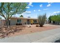 Charming single-story home with desert landscaping and a well-maintained exterior at 3814 E Poinsettia Dr, Phoenix, AZ 85028