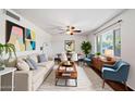 Bright living room featuring modern decor, stylish furniture, and ample natural light at 3814 E Poinsettia Dr, Phoenix, AZ 85028