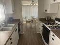 Efficient kitchen featuring light countertops, and direct sight lines to the dining area at 4065 E University Dr # 155, Mesa, AZ 85205
