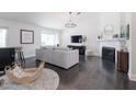 Bright living room features vaulted ceilings, fireplace, and dark wood floors at 4313 E Briarwood Ter, Phoenix, AZ 85048