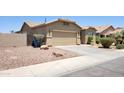 Charming single-story home with a two-car garage and low maintenance desert landscaping at 4432 W Pleasant Ln, Laveen, AZ 85339