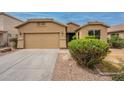 Exterior image showcasing the driveway and front of the home at 4432 W Pleasant Ln, Laveen, AZ 85339