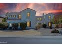 An elegant, multi-story home featuring architectural details and manicured landscaping creating a welcoming curb appeal at 4517 W Lodge Dr, Laveen, AZ 85339