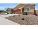 Lovely single-story home featuring desert landscaping and an attached two-car garage at 4628 W Greenleaf Dr, San Tan Valley, AZ 85144
