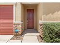 Close-up of the front entrance with stone accents and a classic, wood-stained front door at 4628 W Greenleaf Dr, San Tan Valley, AZ 85144